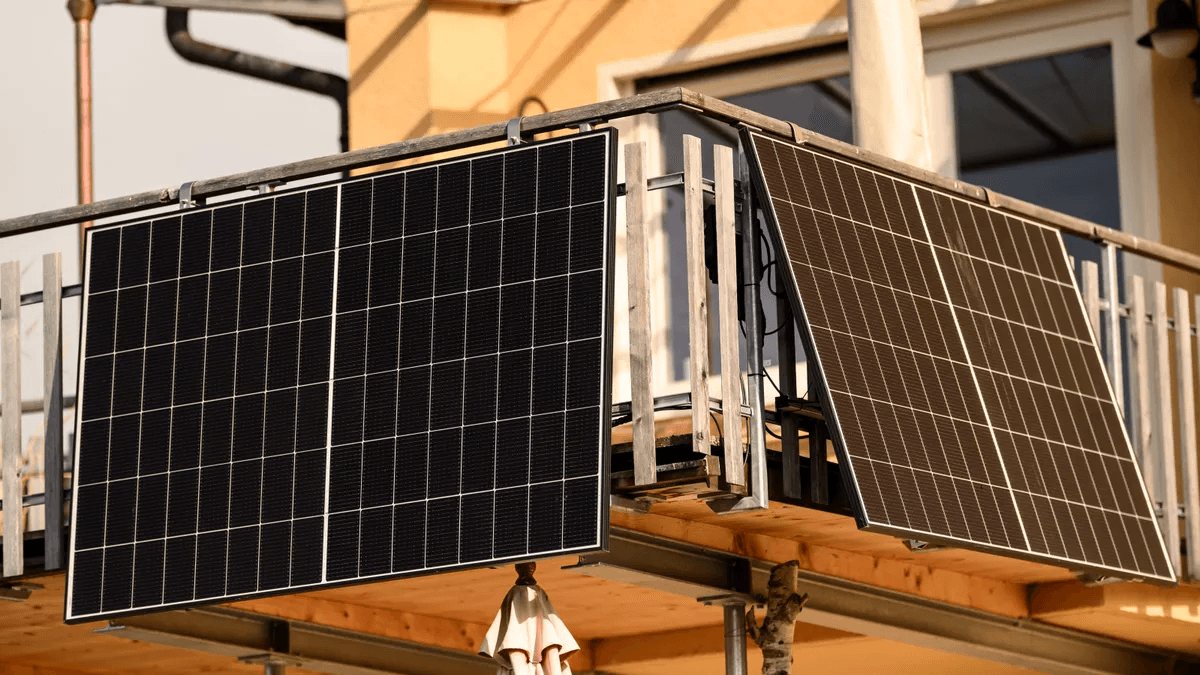 Wooden deck balcony with dual-panel solar mounting system